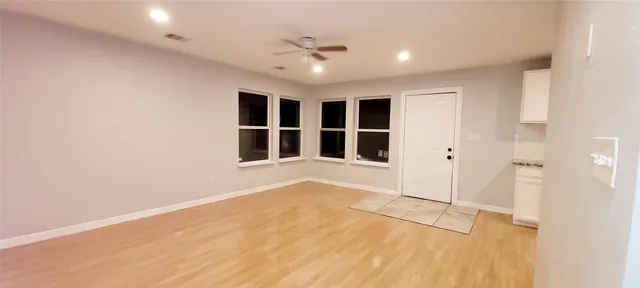 a view of an empty room with a window