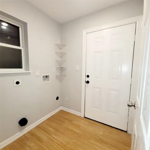 a view of a livingroom with wooden floor