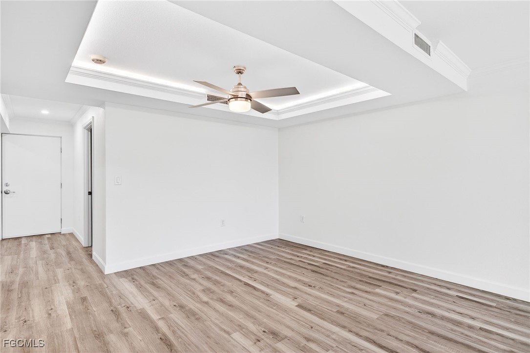 200 Periwinkle Way, Unit 124 Sanibel, FL 33957 - Photo 17 of 50 a view of a room with wooden floor