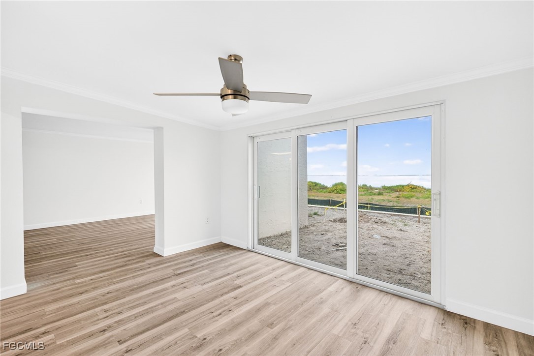 200 Periwinkle Way, Unit 124 Sanibel, FL 33957 - Photo 20 of 50 a view of wooden floor and windows in a room