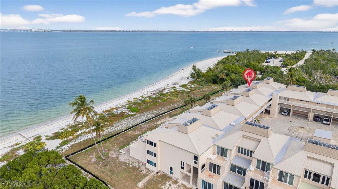 200 Periwinkle Way, Unit 124 Sanibel, FL 33957 - Photo 41 of 50 a view of a swimming pool with an outdoor seating