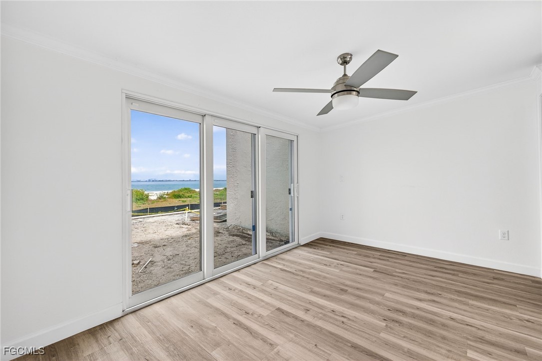 200 Periwinkle Way, Unit 124 Sanibel, FL 33957 - Photo 10 of 50 wooden floor in an empty room