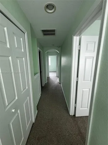 a view of a room that has a window in it
