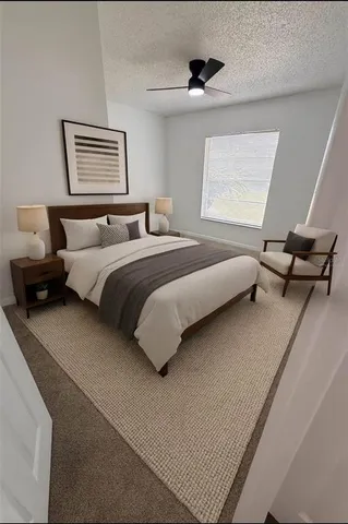 a bedroom with bed and window