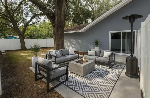 a outdoor living space with furniture and a potted plant