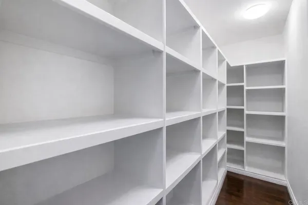 a view of a dining room with furniture wooden floor and chandelier