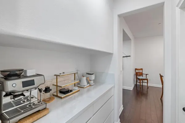 a dining room with furniture a chandelier and window