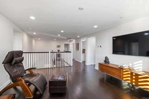 a spacious bedroom with a bed and a large window