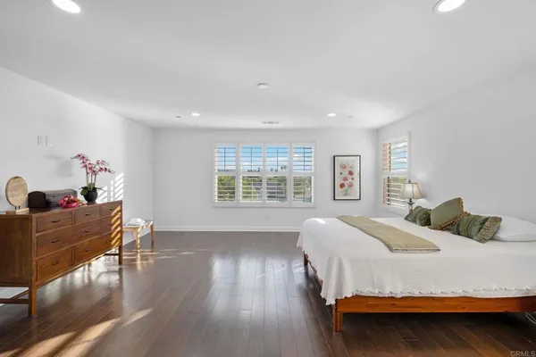 a spacious bathroom with a bathtub sink and mirror