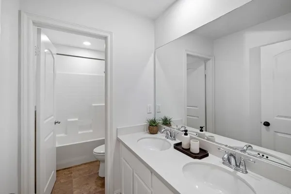 a bedroom with a large bed and a large window