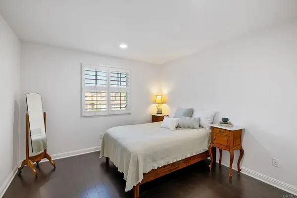 a sitting area with glass door and balcony