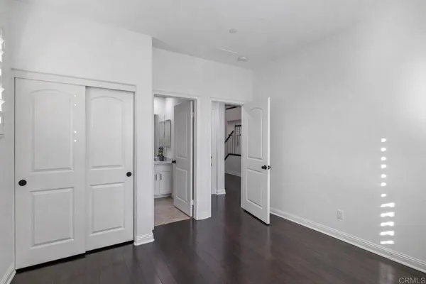 wooden floor with white walls