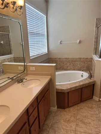 a bathroom with a bathtub and a sink