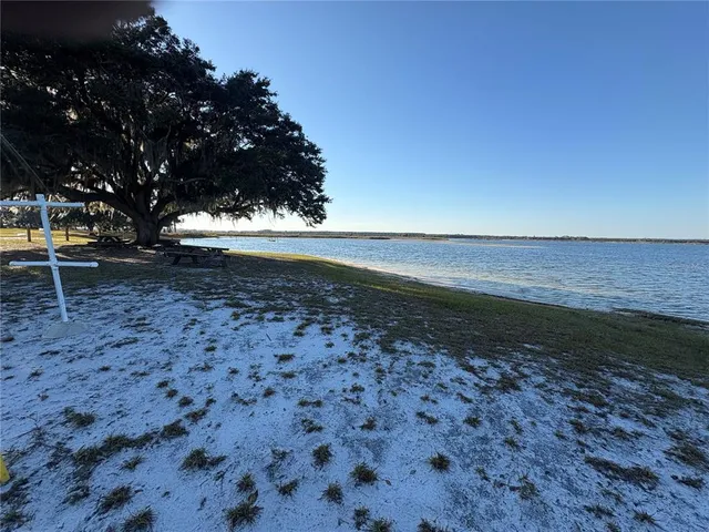 a view of a backyard of the house