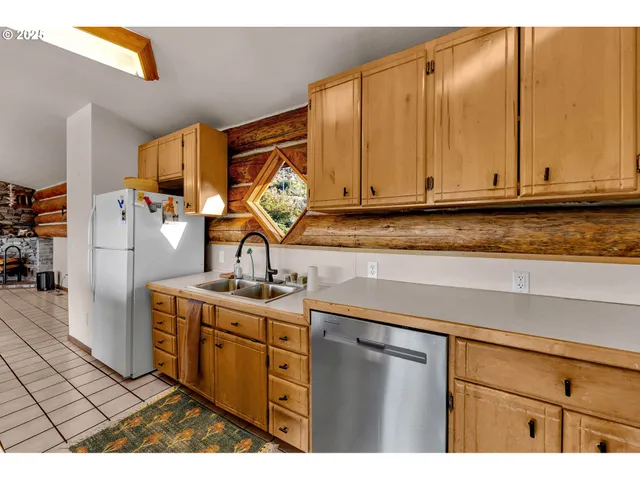 a kitchen with a sink and a stove