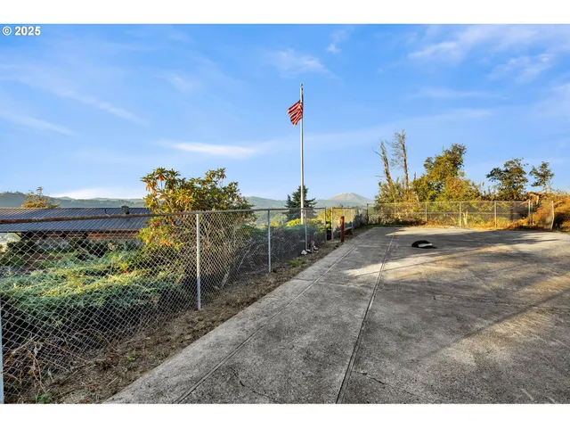 a view of a garden with a building in the background
