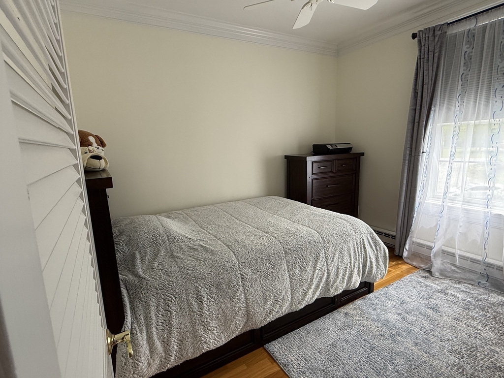 5 Porter Road, Unit 202 Andover, MA 01810 - Photo 11 of 17 a bedroom with a bed and a window