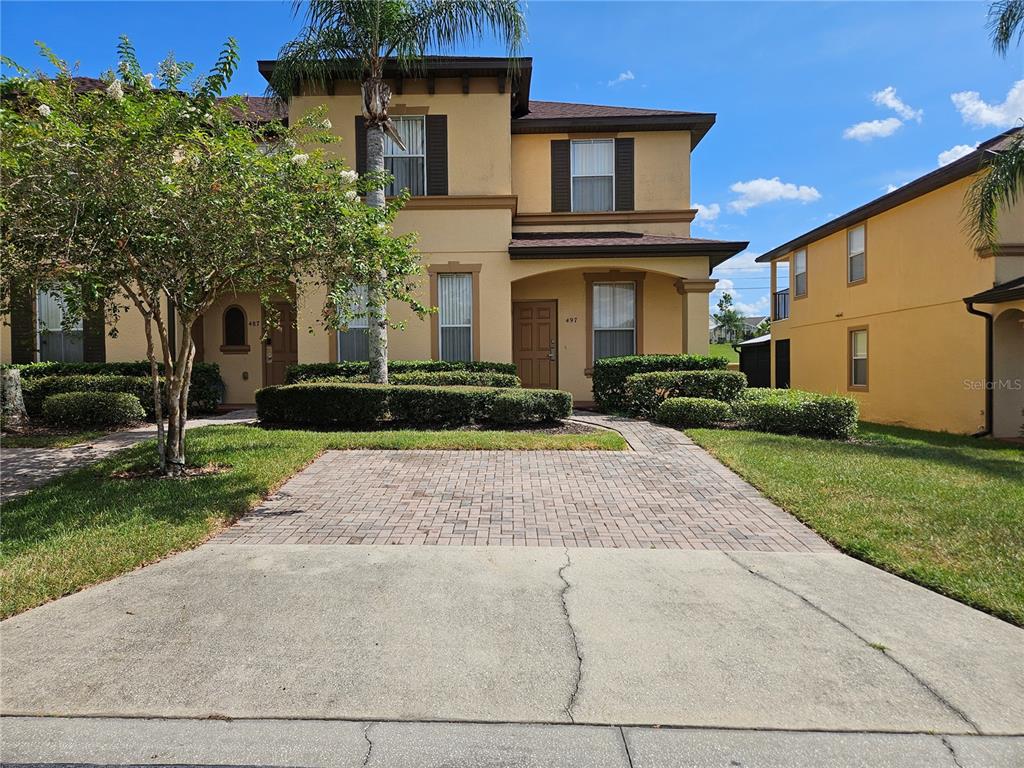 497 La Mirage Street Davenport, FL 33897 - Photo 1 of 18 a front view of a house with a yard