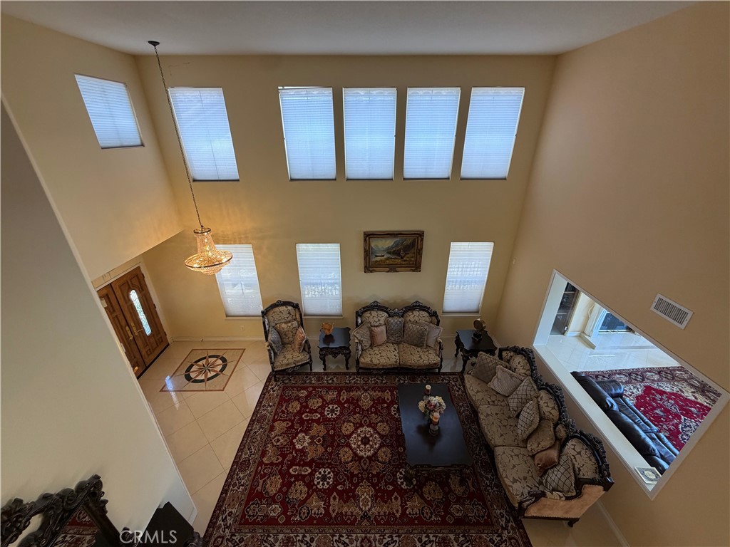 19823 Mariposa Pines Way Porter Ranch, CA 91326 - Photo 21 of 50 a bed room with a bed furniture and a window