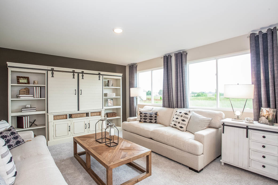 3818 Doherty Lane McHenry, IL 60050 - Photo 7 of 10 a living room with furniture and large windows