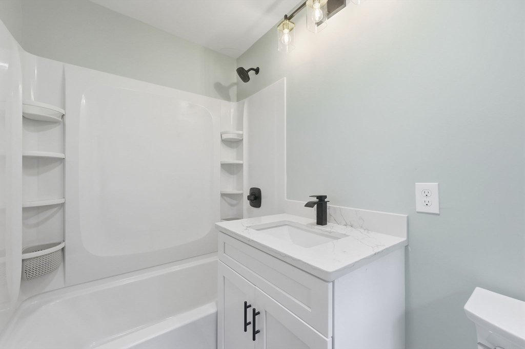 75 Lead Mine Road Southampton, MA 01073 - Photo 38 of 42 a bathroom with a sink and a bathtub