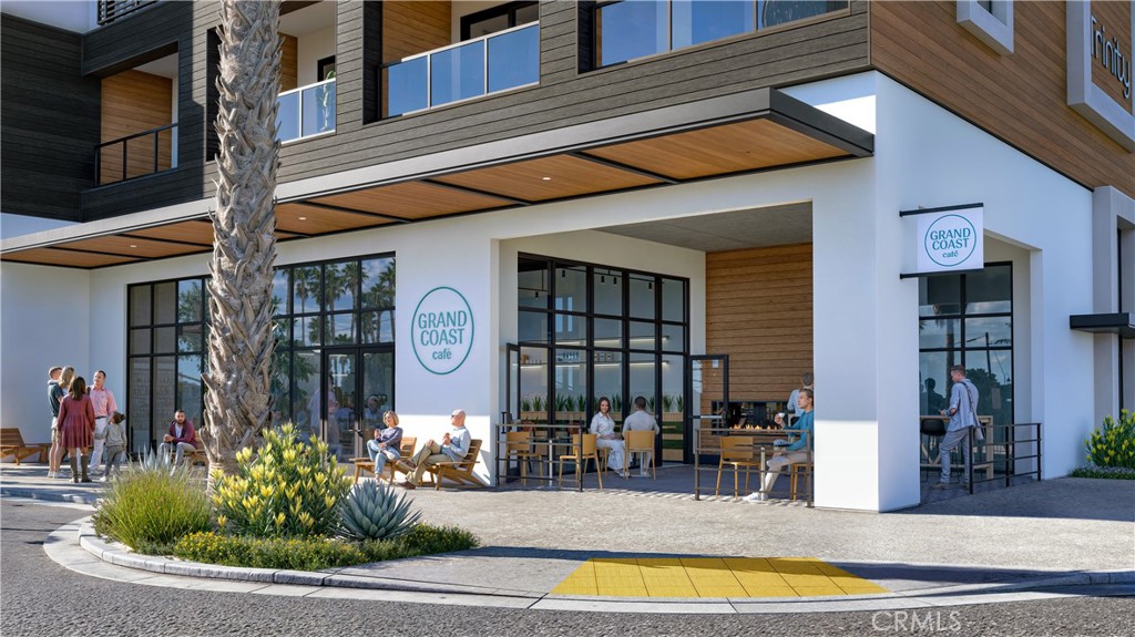 100 Ramona Avenue Grover Beach, CA 93433 - Photo 10 of 23 a front view of a building with large windows and flowers