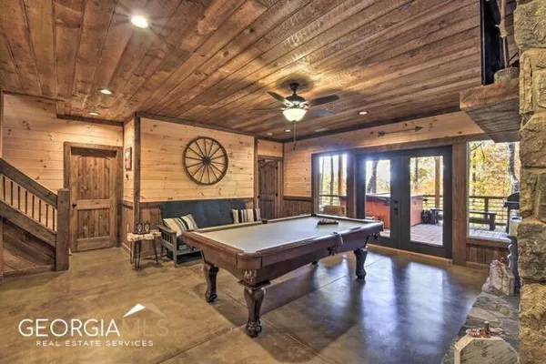 a room with lots of furniture and a clock