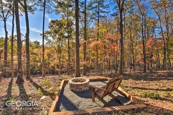 a view of swimming pool with outdoor seating