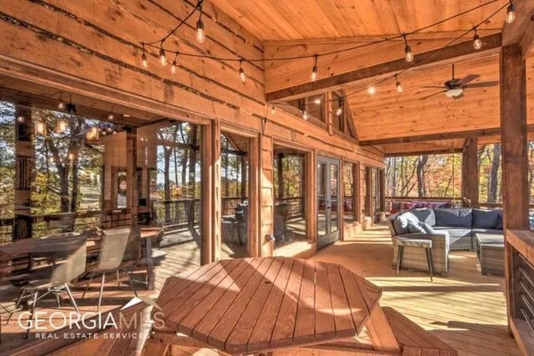 a view of a patio with swimming pool table and chairs