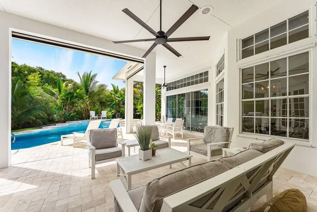 a view of a house with backyard sitting area and garden