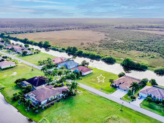 an aerial view of a houses with outdoor space