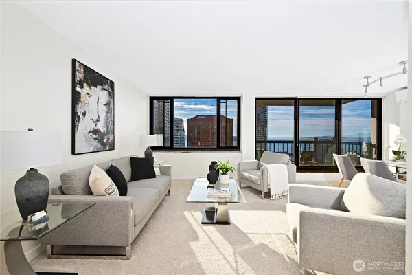 a living room with furniture and a large window