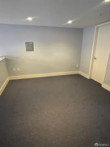 an empty room with a hard wood floor