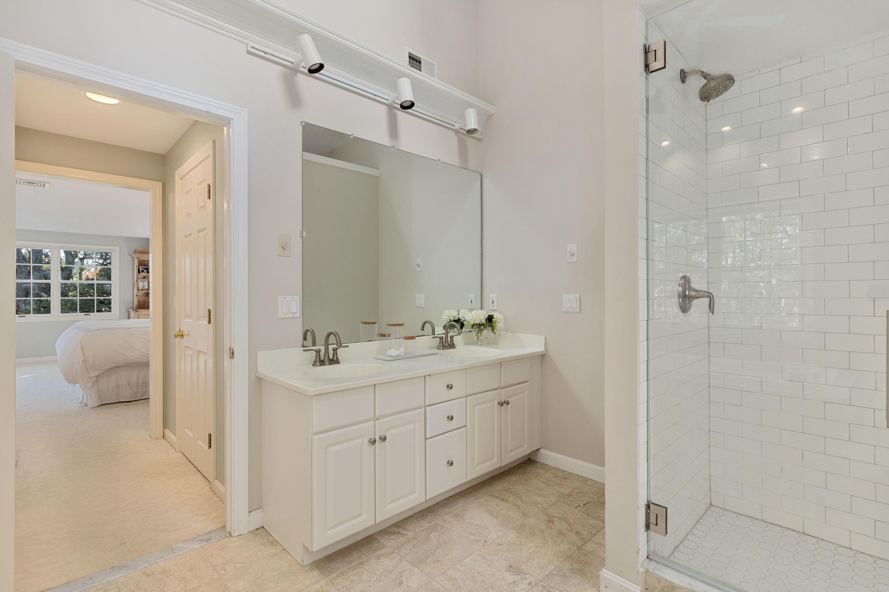 461 South Main Street Centerville, MA 02632 - Photo 27 of 52 a bathroom with a double vanity sink mirror and shower