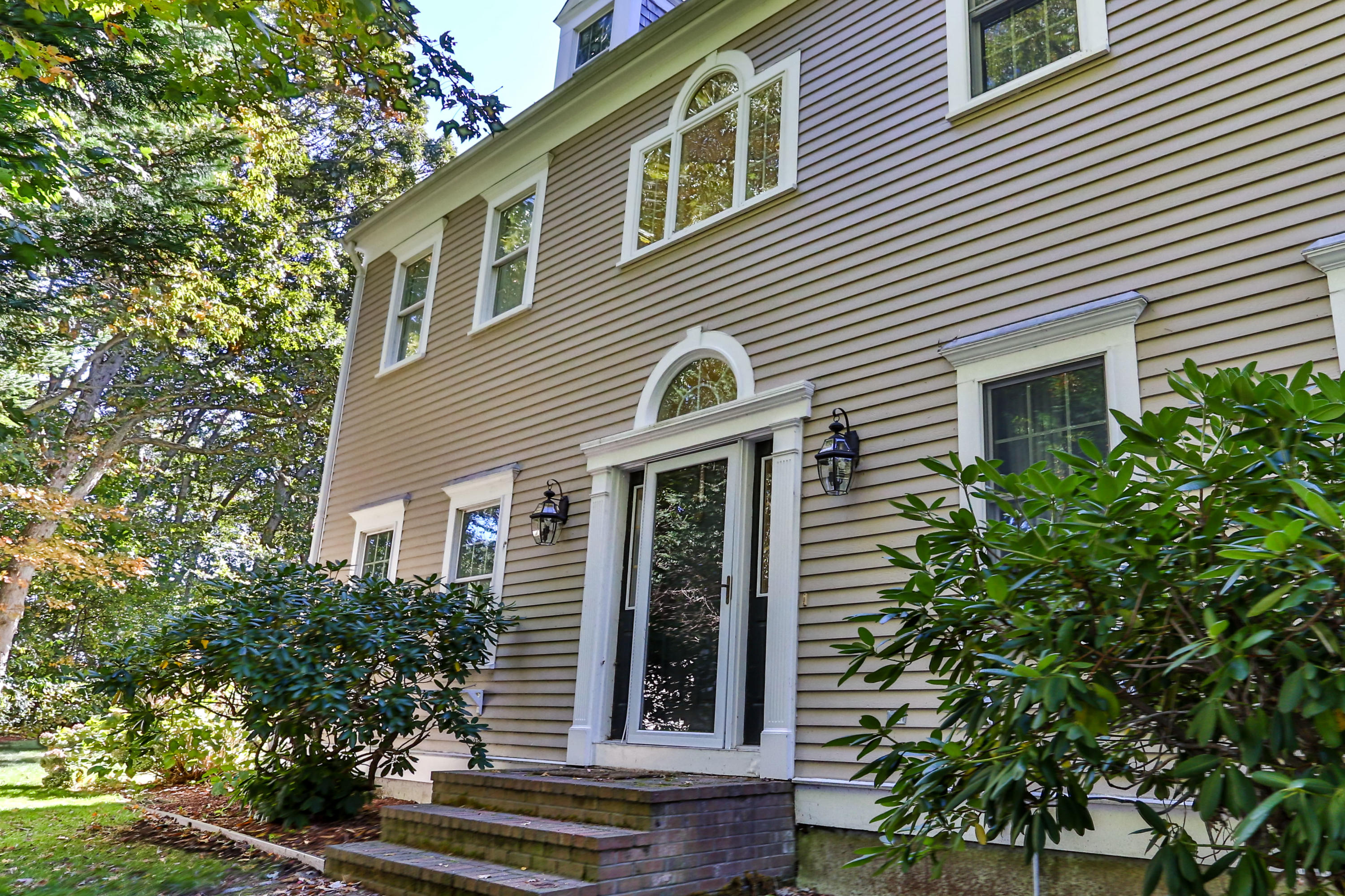 461 South Main Street Centerville, MA 02632 - Photo 45 of 52 a view of a house with a potted plant and a large tree