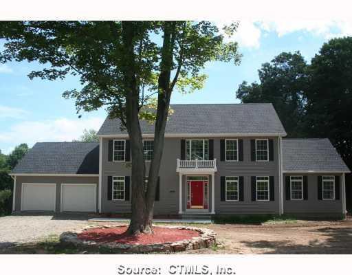 Exterior Front. CIURCULAR DRIVEWAY