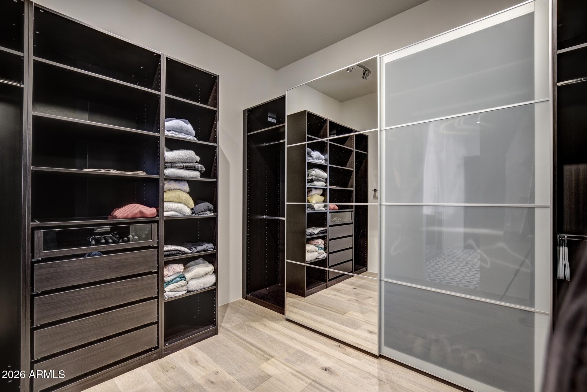 610 South Valhalla Payson, AZ 85541 - Photo 14 of 37 a view of walk in closet with clothes and shoes