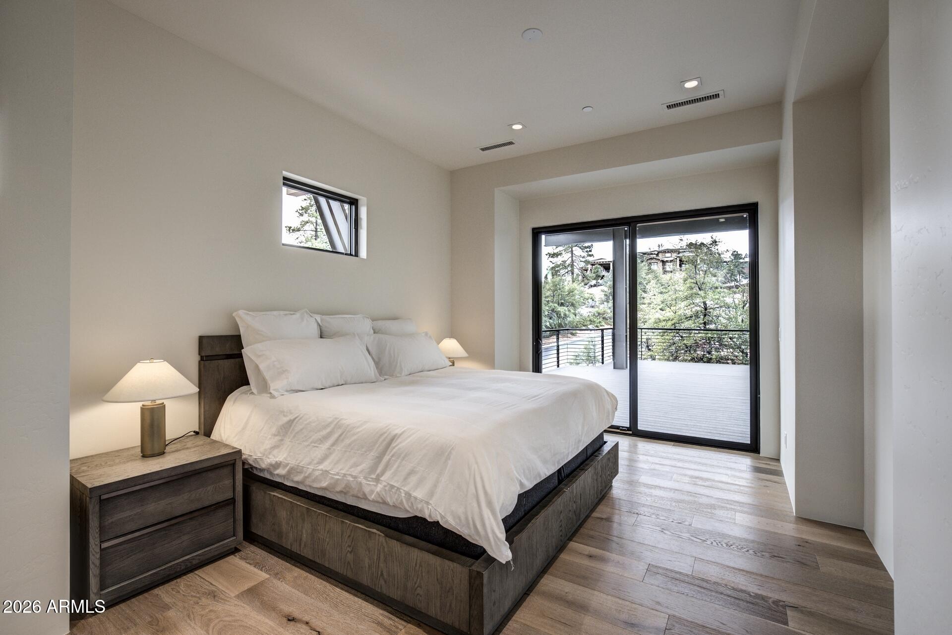 610 South Valhalla Payson, AZ 85541 - Photo 17 of 37 a bedroom with a large bed and a large window