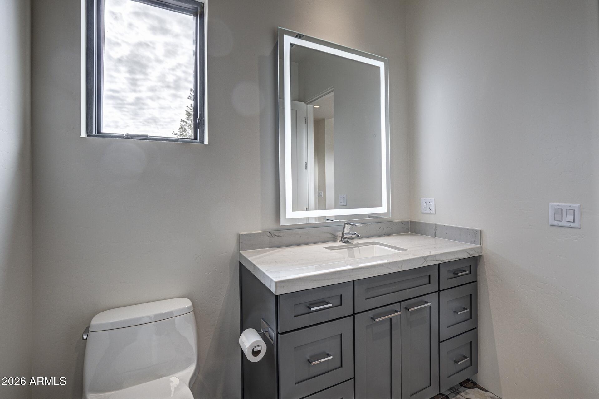 610 South Valhalla Payson, AZ 85541 - Photo 19 of 37 a bathroom with a granite countertop sink toilet and mirror