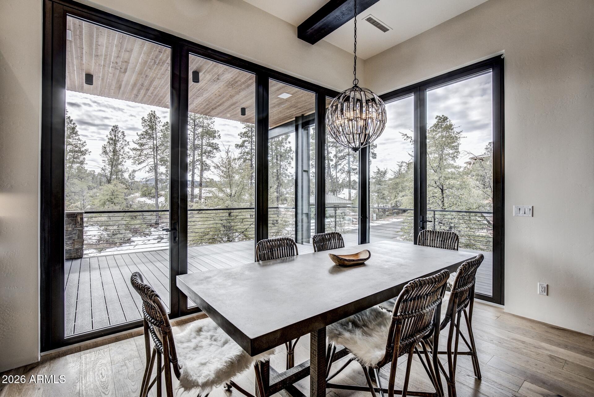 610 South Valhalla Payson, AZ 85541 - Photo 8 of 37 a view of a dining room with furniture window and wooden floor