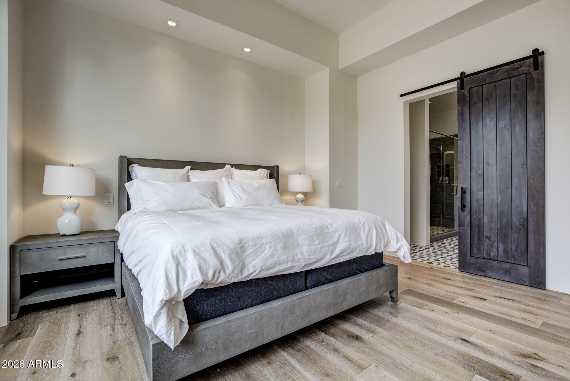 610 South Valhalla Payson, AZ 85541 - Photo 10 of 37 a spacious bedroom with a bed and a night stand