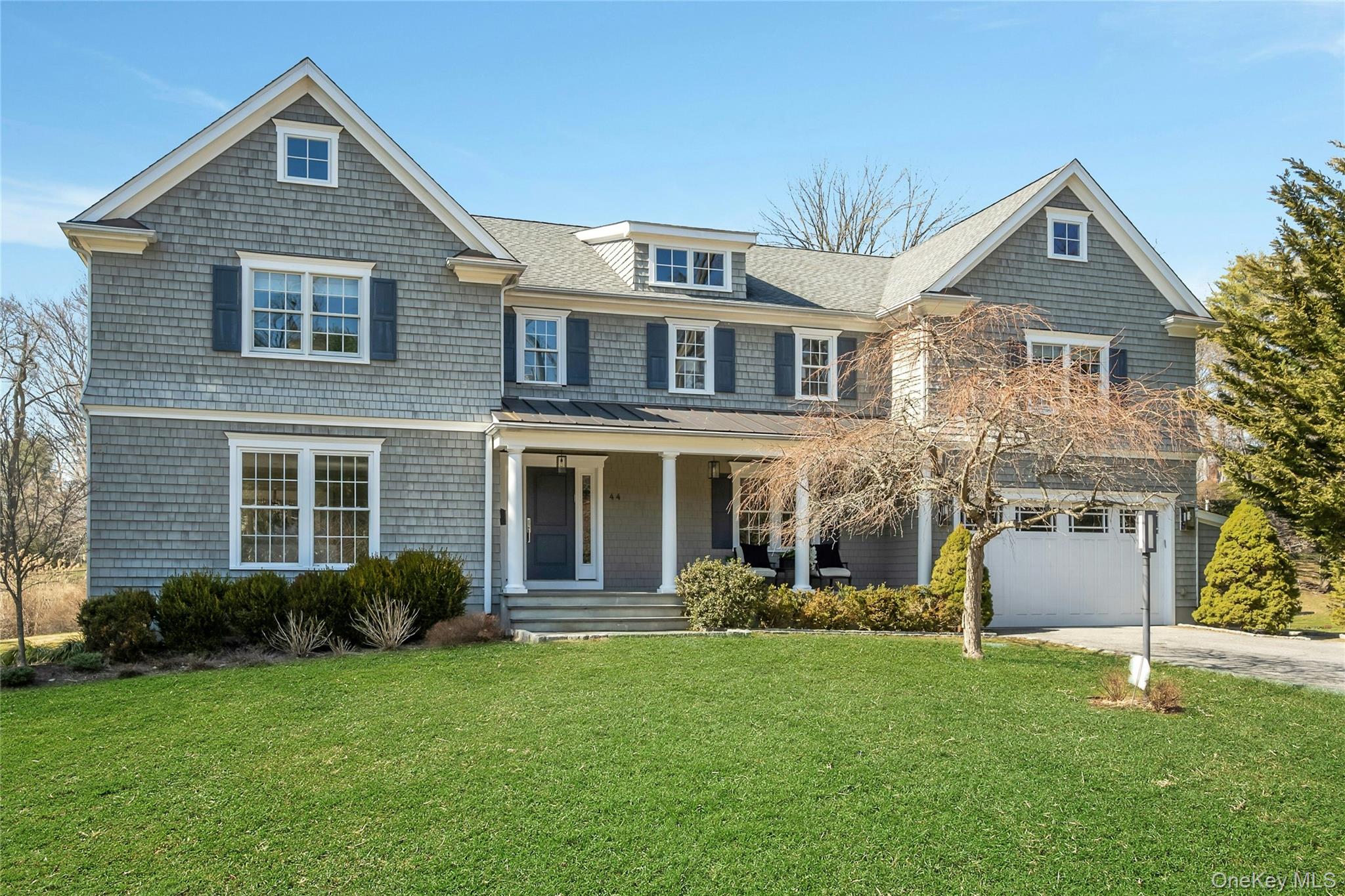 Stunning Designer-Renovated Colonial offers grand scale private retreat near the Long Island Sound.