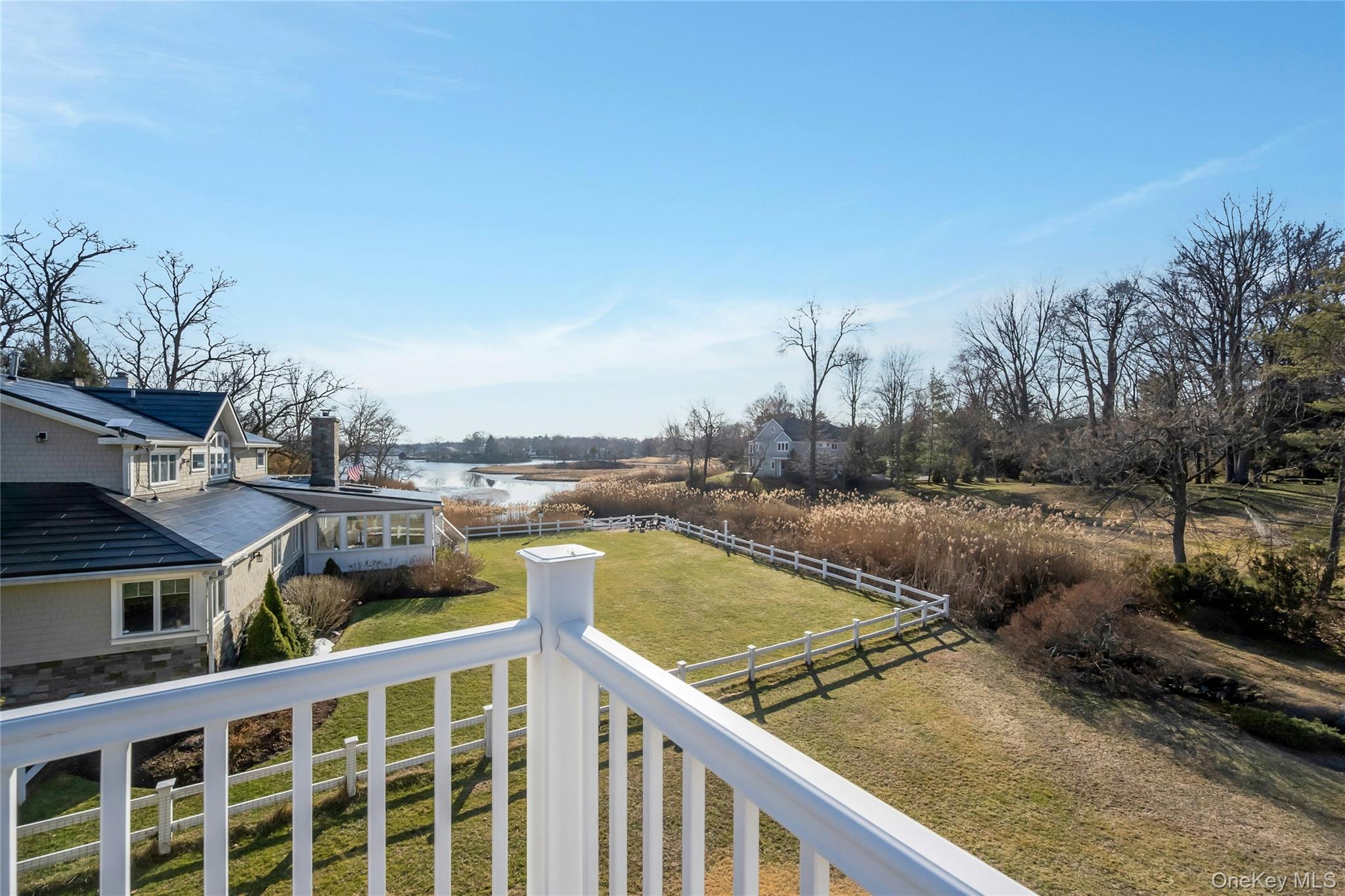 44 Brevoort Lane Rye, NY 10580 - Photo 17 of 32 View from the terrace overlooking sweeping water views and peaceful open landscapes-the perfect setting for unforgettable sunsets.