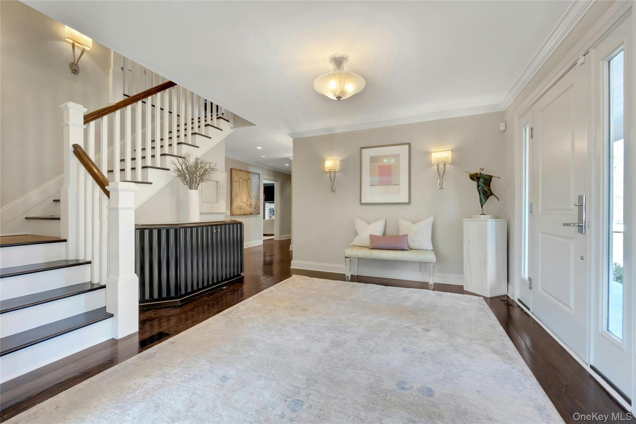 44 Brevoort Lane Rye, NY 10580 - Photo 2 of 32 Dramatic, light filled entrance with elegant proportions flows into grand-scaled living spaces beyond