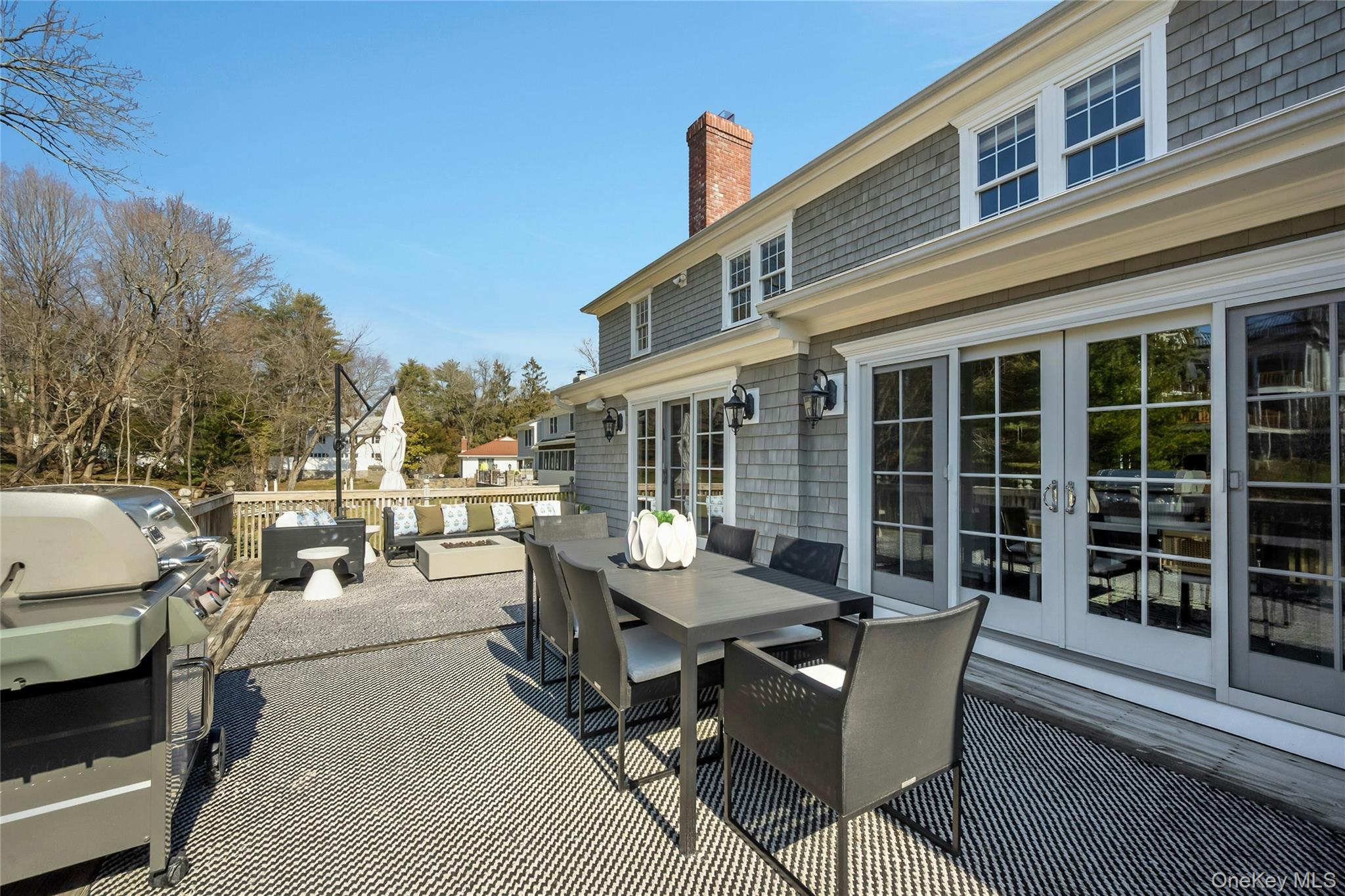 44 Brevoort Lane Rye, NY 10580 - Photo 29 of 32 Endless summer evenings begin here-a huge deck made for grilling, dining and entertaining. Soak in the beauty of Rye living