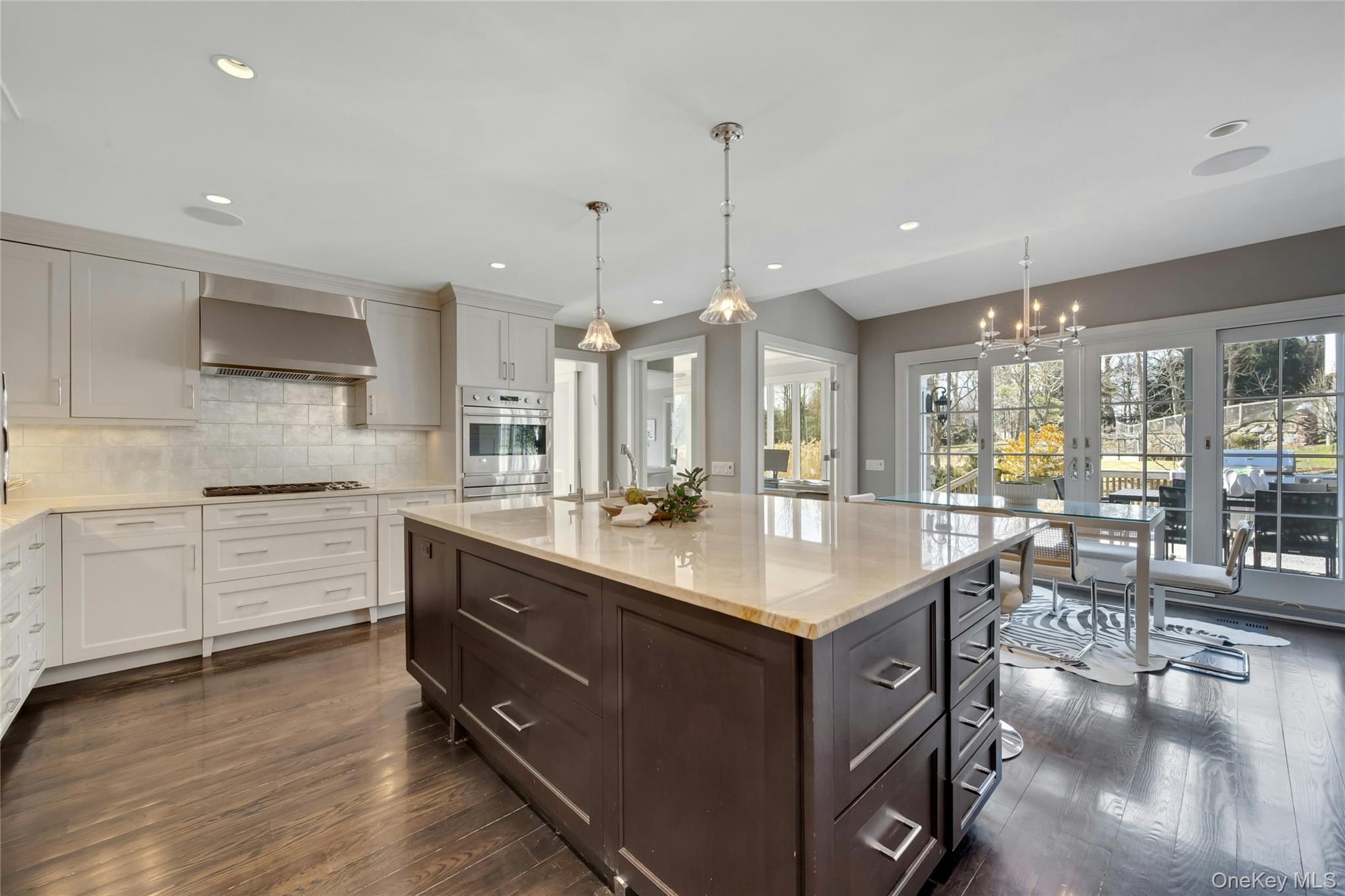 44 Brevoort Lane Rye, NY 10580 - Photo 8 of 32 A stunning Bilotta-designed kitchen anchored by a dramatic huge island surrounded by sun-filled windows