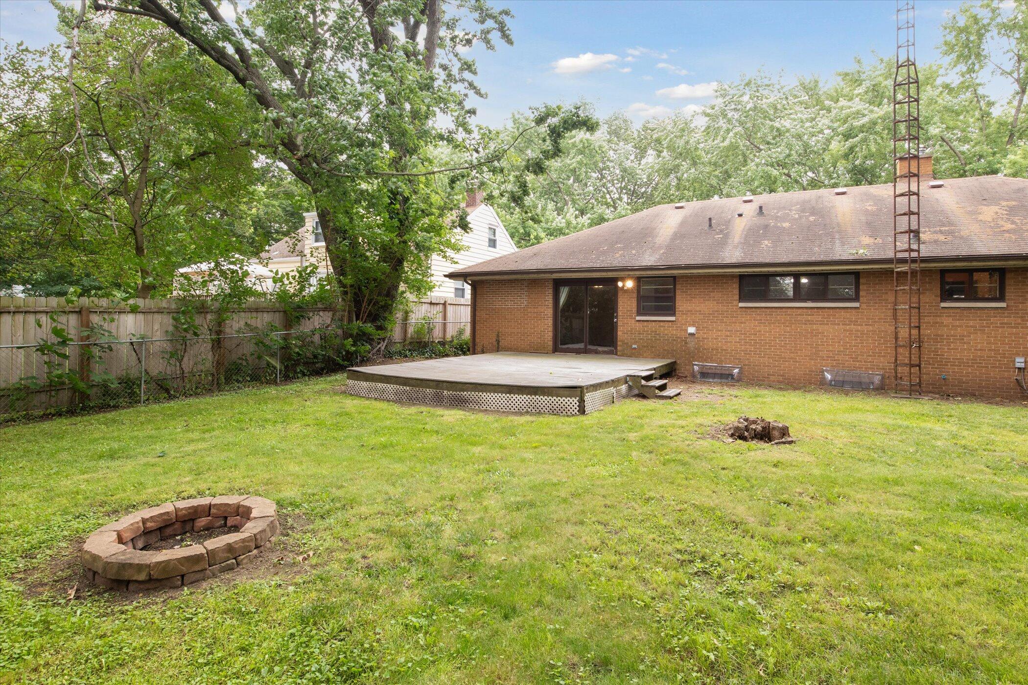 159 Elmside Road Benton Harbor, MI 49022 - Photo 44 of 53 Firepit and Grass. Fenced.