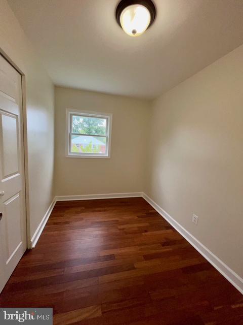 2301 Wyngate Road Suitland, MD 20746 - Photo 11 of 16 a view of an empty room with wooden floor and a window