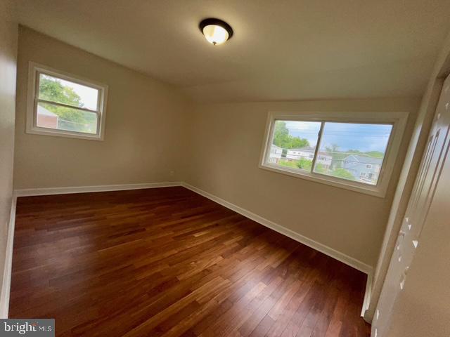 2301 Wyngate Road Suitland, MD 20746 - Photo 12 of 16 an empty room with wooden floor and windows