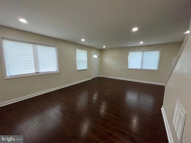 2301 Wyngate Road Suitland, MD 20746 - Photo 4 of 16 an empty room with wooden floor and windows